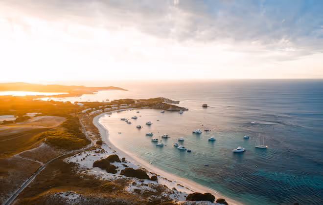 Rottnest Island, Western Australia with boats and clear blue water, a scenic destination for solo travellers over 50.