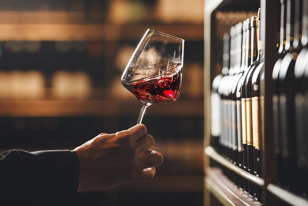 Person tasting red wine at Moffatdale Ridge Winery in Queensland’s South Burnett wine region.