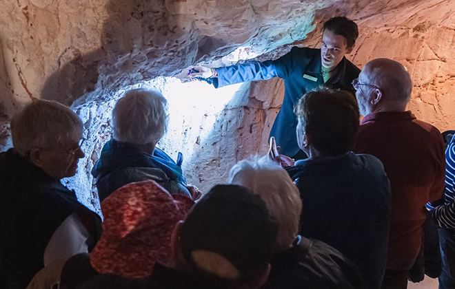 Visitors exploring Umoona Opal Mine underground museum