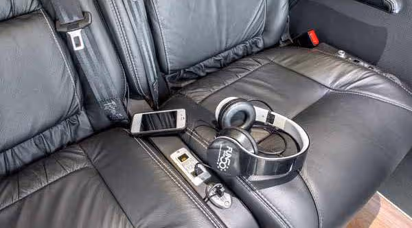 Diamond Class coach seat with FUN-branded headphones and onboard entertainment controls