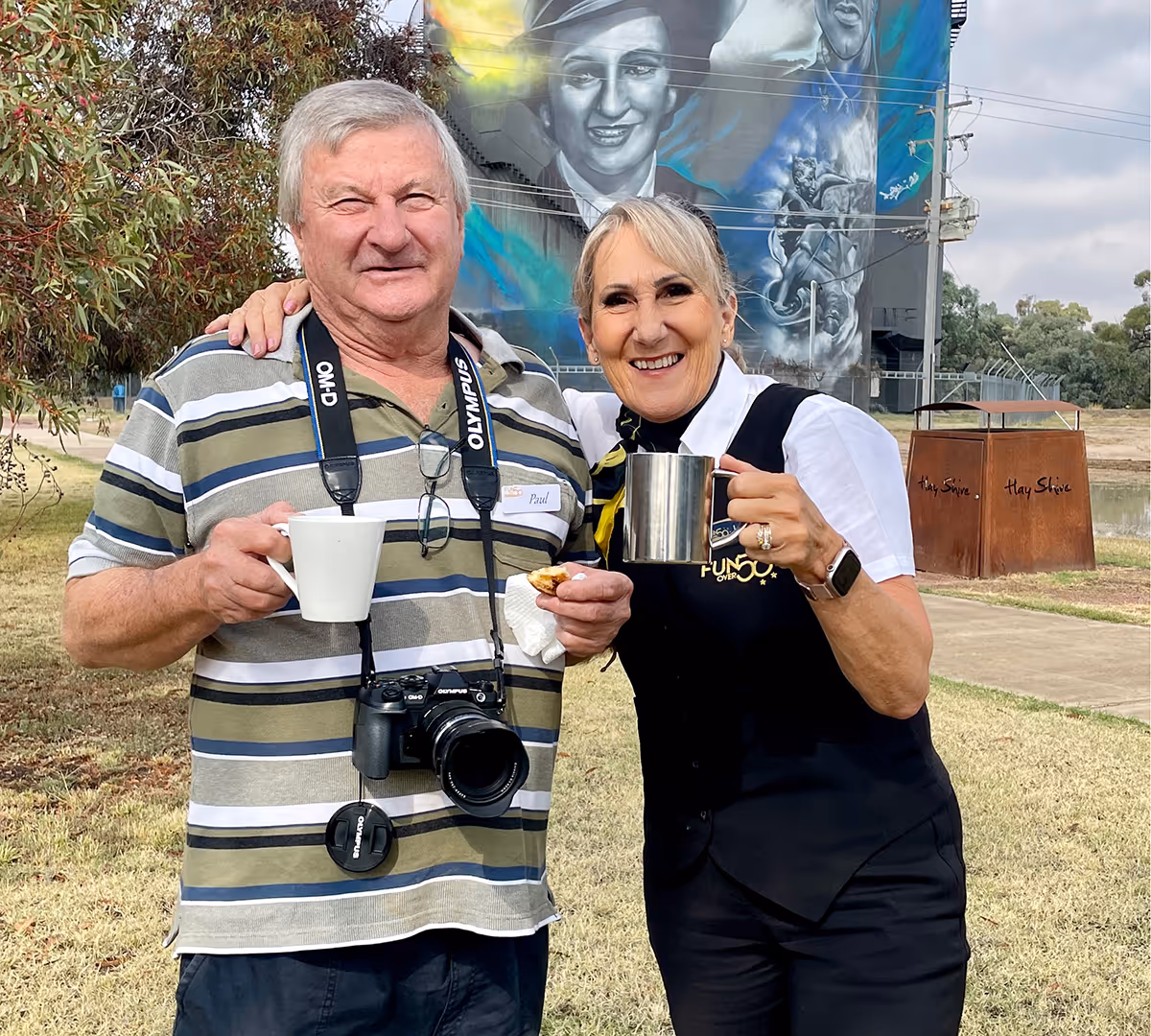 Tour host and guest enjoying refreshments during a tour stop