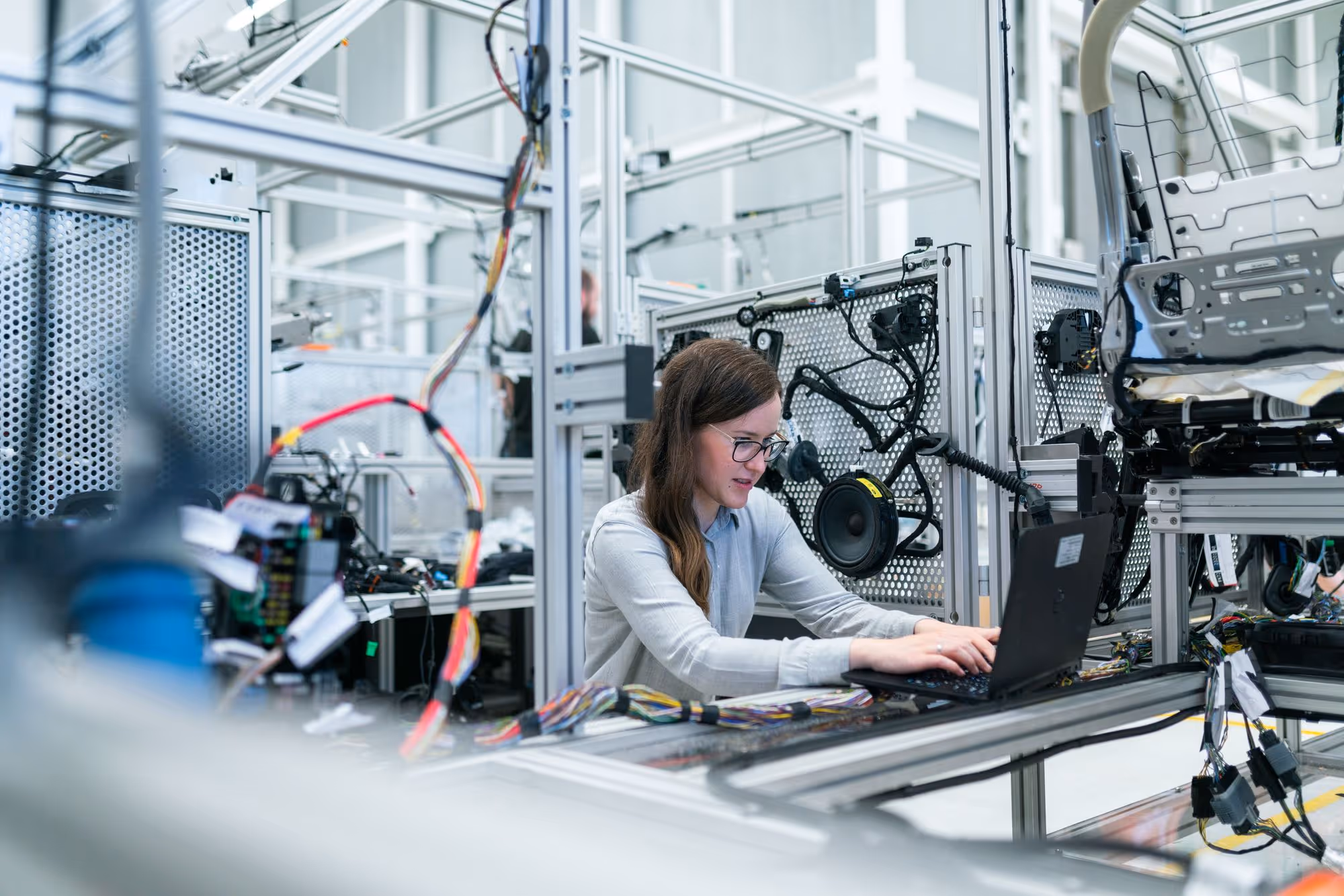 Woman working surrounded by hardware