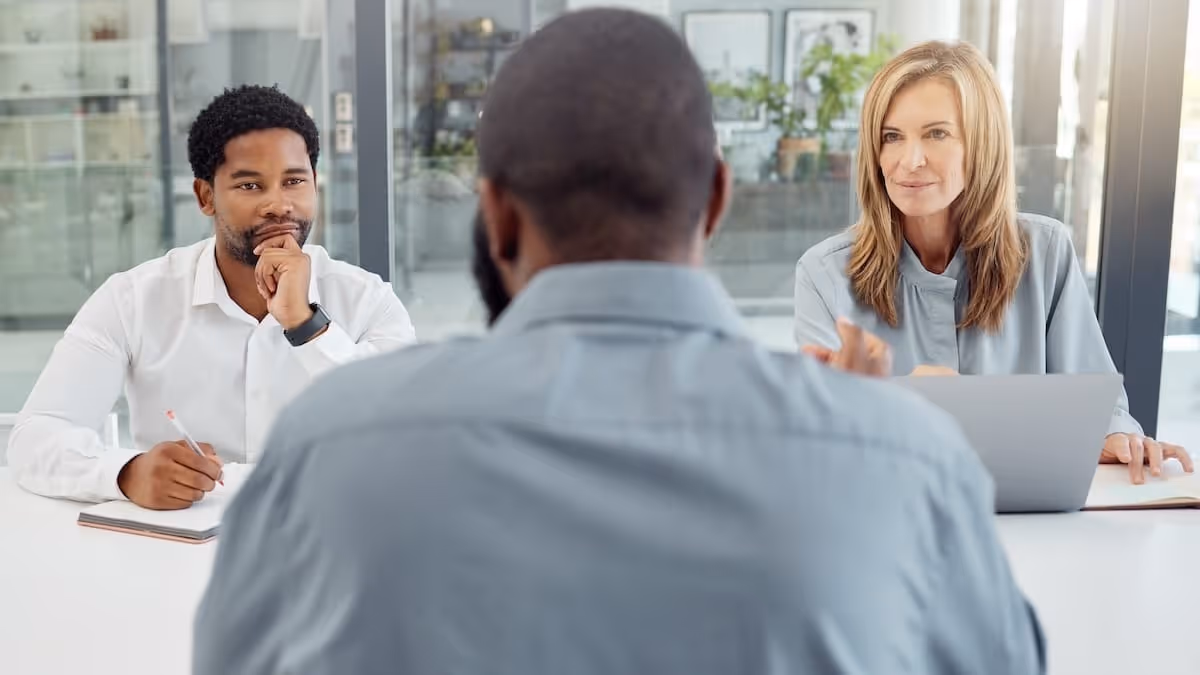 Two recruiters interviewing a job candidate