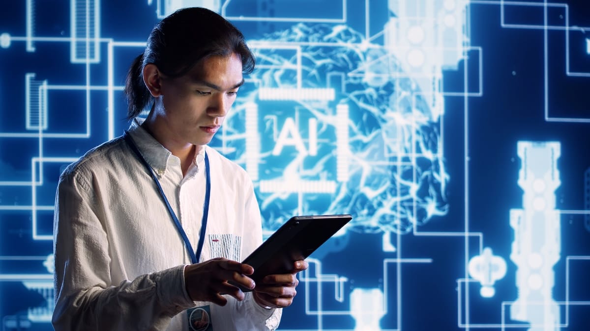 AI engineer using a tablet in front of a futuristic background