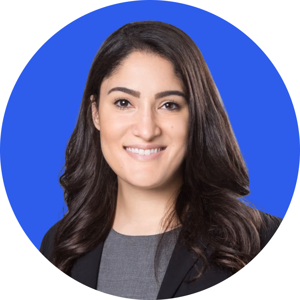 Headshot of a woman against a blue background