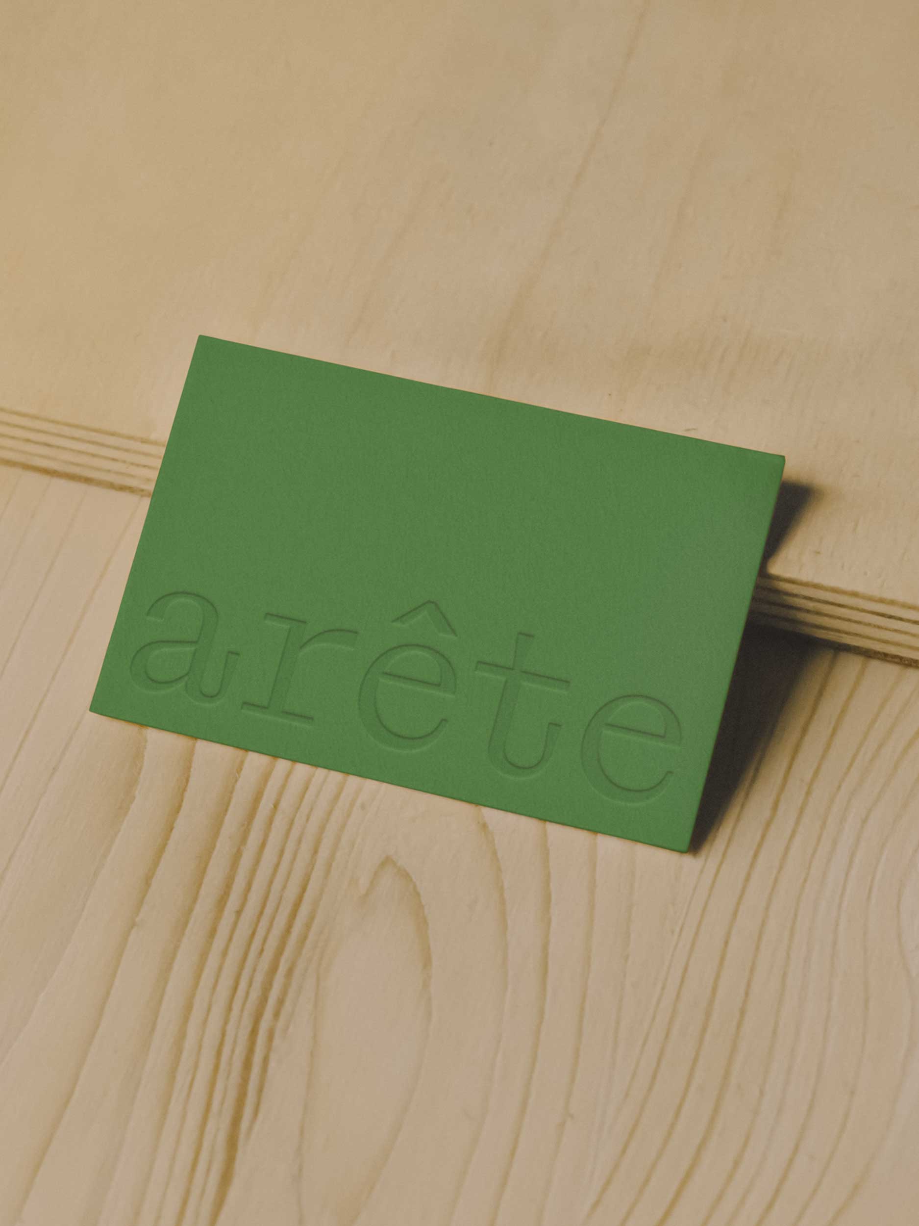 Arête Architects green embossed business card design