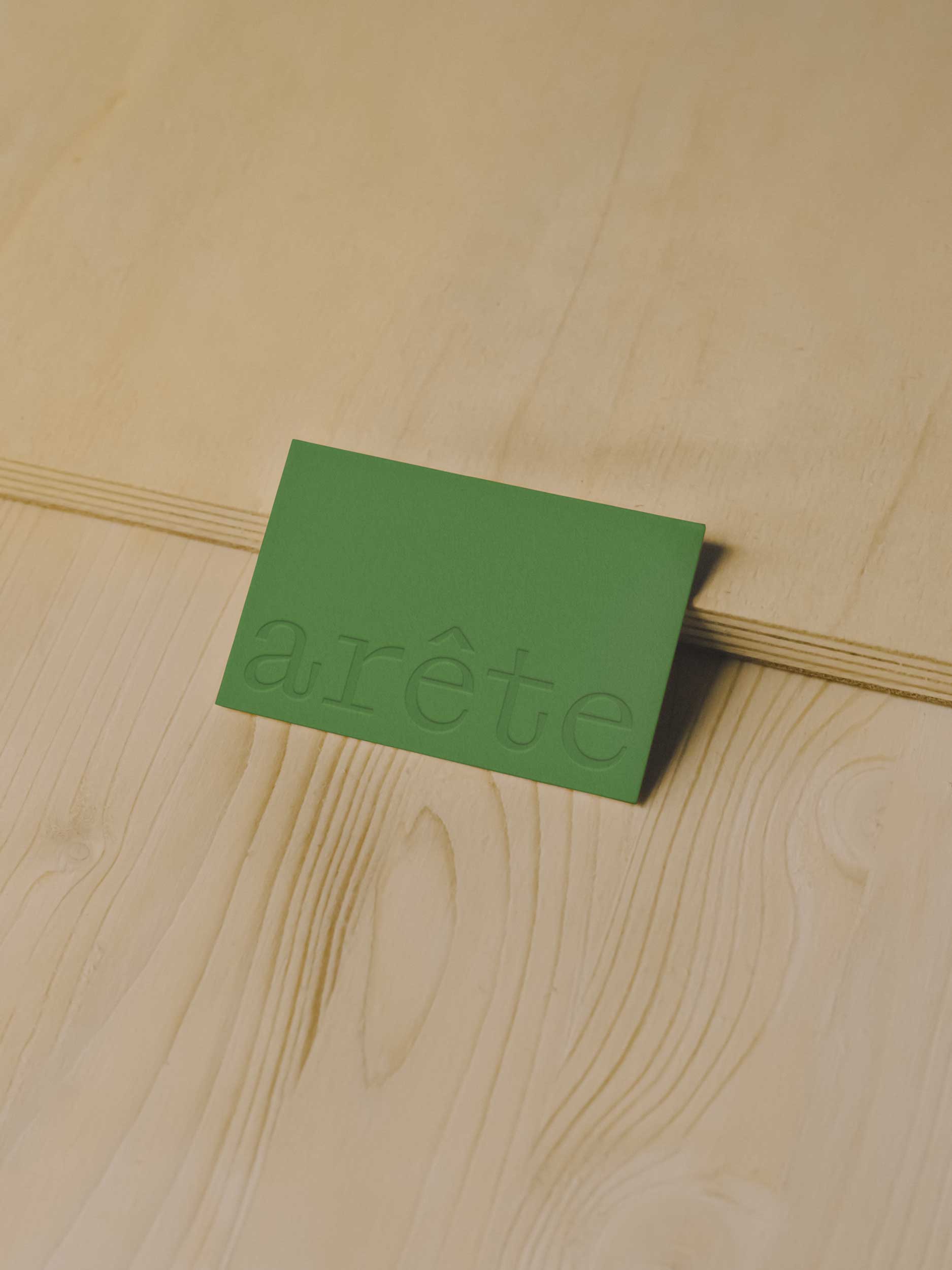 Arête Architects green embossed business card design