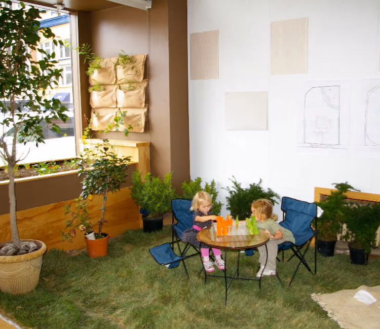 kids playing chess in the indoor Park(ing) Day parklet 2010
