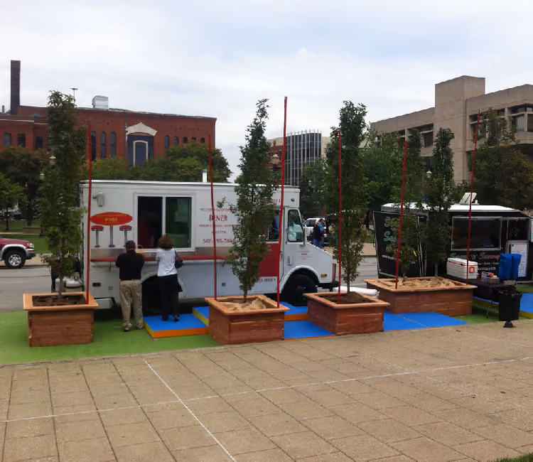 Tactical urbanism planters setup for food truck corral during 2013 Park(ing) Week