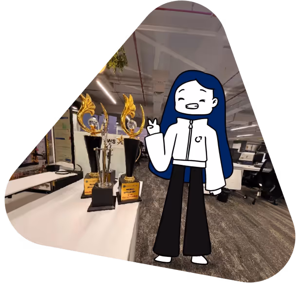 Cartoon character with long blue hair and white jacket making a peace sign, standing next to three golden trophies on a desk in an office.