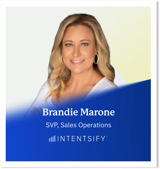 Brandie Marone, SVP Sales Operations at Intentsify, smiling with crossed arms in a white top.