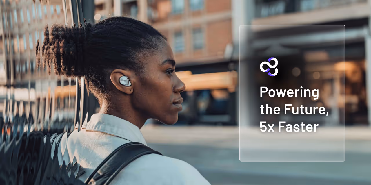 Ateios Powering the Future 5x Faster text over an image of a woman looking to cross a city street. Focused on the headphone in her ear.