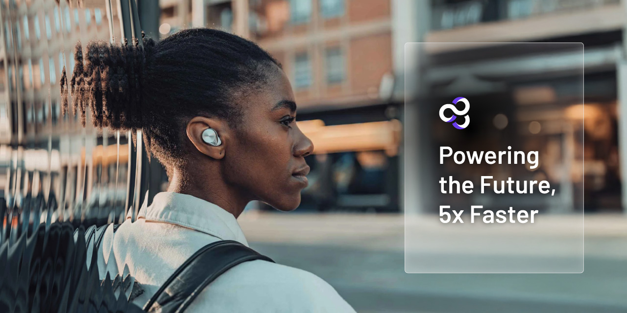 Ateios Powering the Future 5x Faster text over an image of a woman looking to cross a city street. Focused on the headphone in her ear.