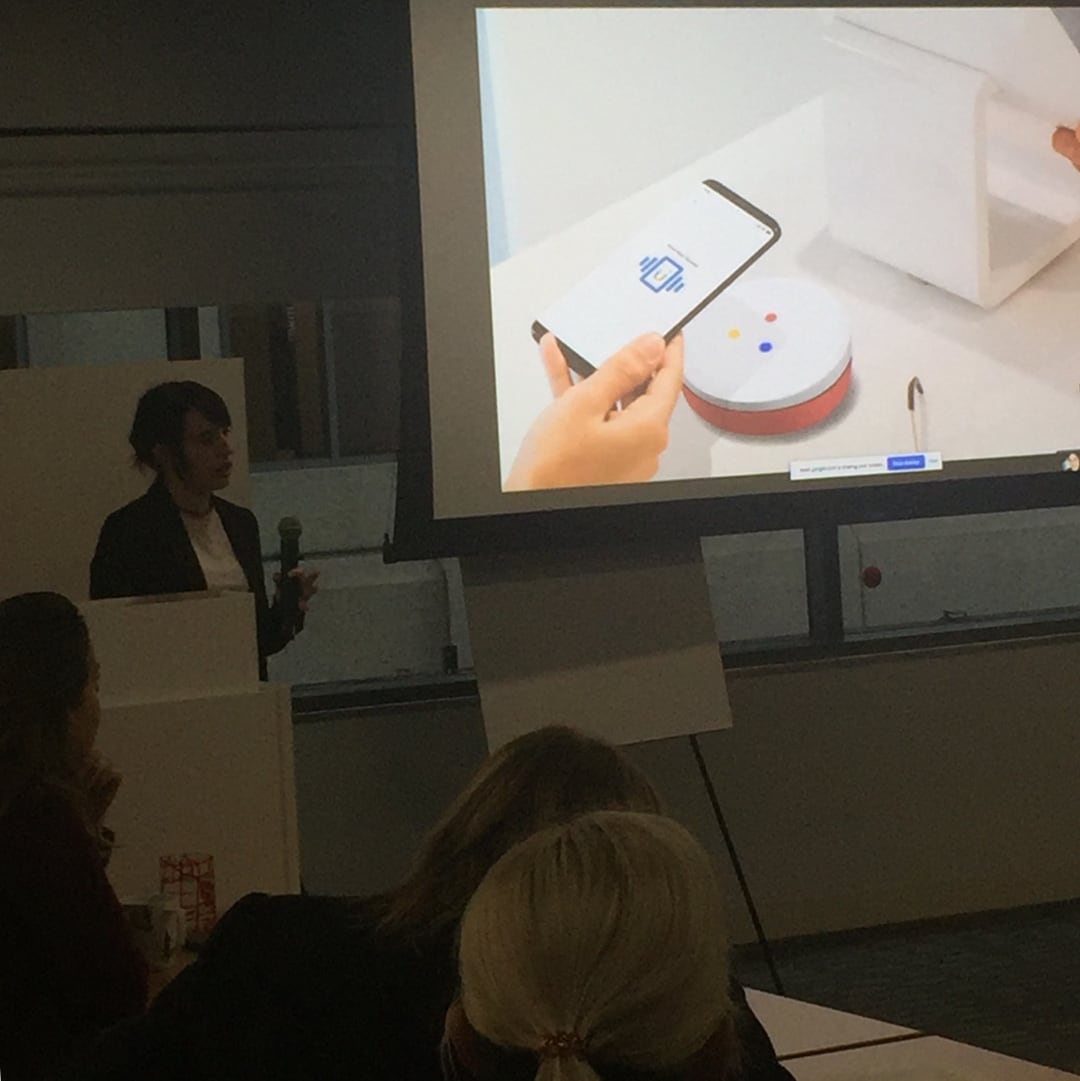 Me presenting in front of a projection screen