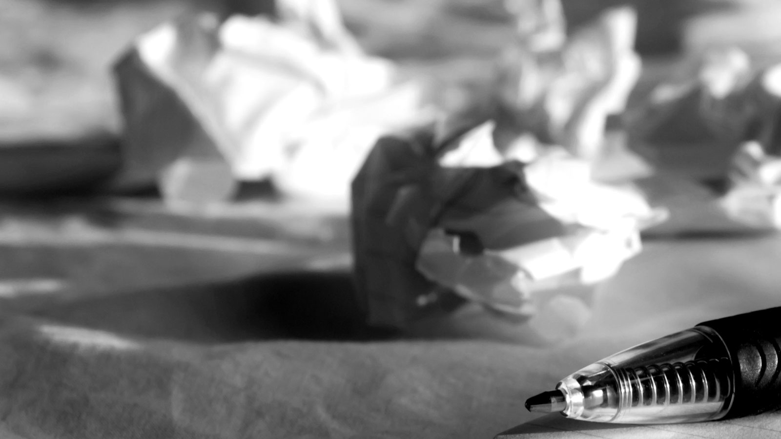 crumpled up paper on desk