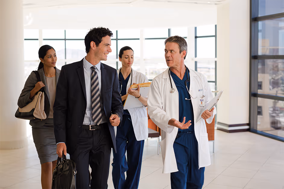 A group of business people walking through a lobby