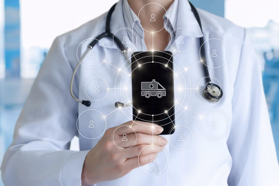 A doctor in a white coat with a stethoscope holds a smartphone displaying a digital ambulance icon. Connected symbols for workforce management and digital healthcare are overlaid on the image.