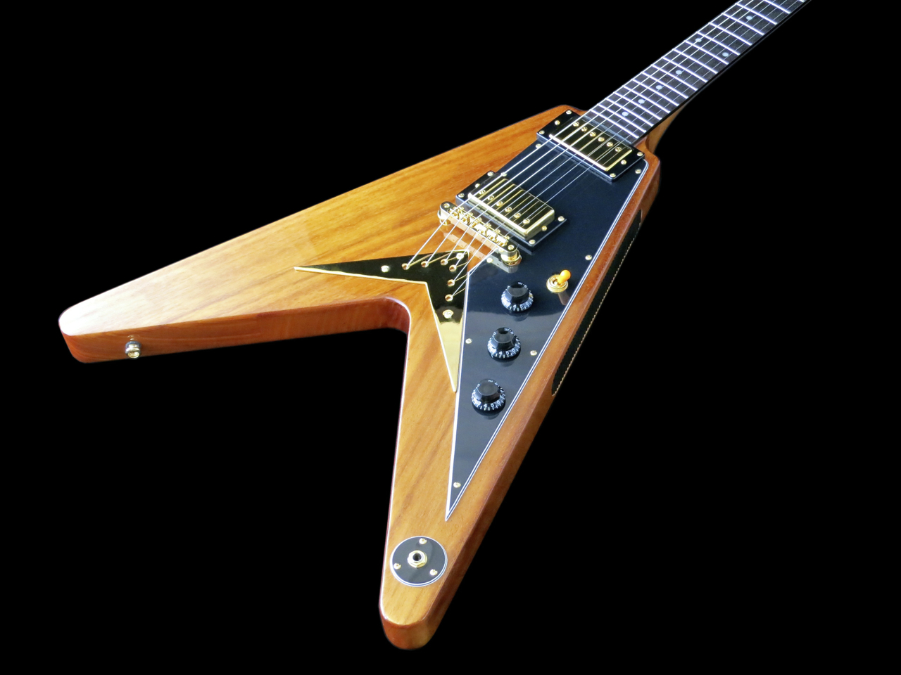 Epiphone Korina Flying V:n talla ja bumerangin muotoinen kieltenpidin