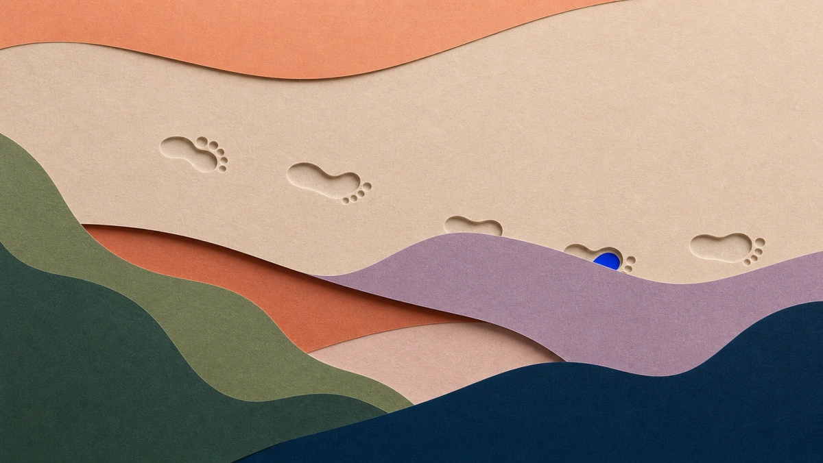 Cut-paper illustration of footprints on a path