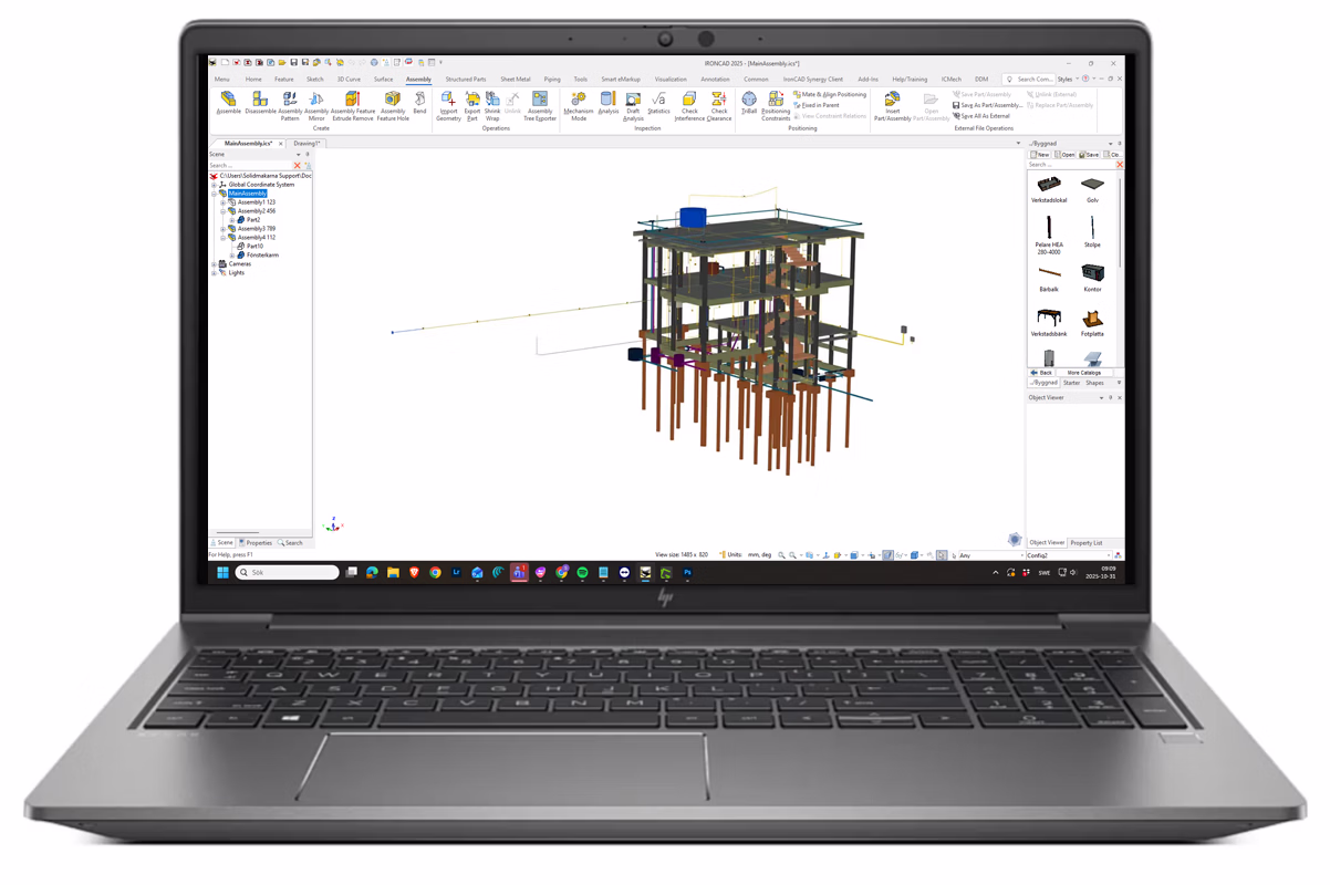 Laptop displaying structural engineering software with a 3D model of a multi-story building foundation and framework.