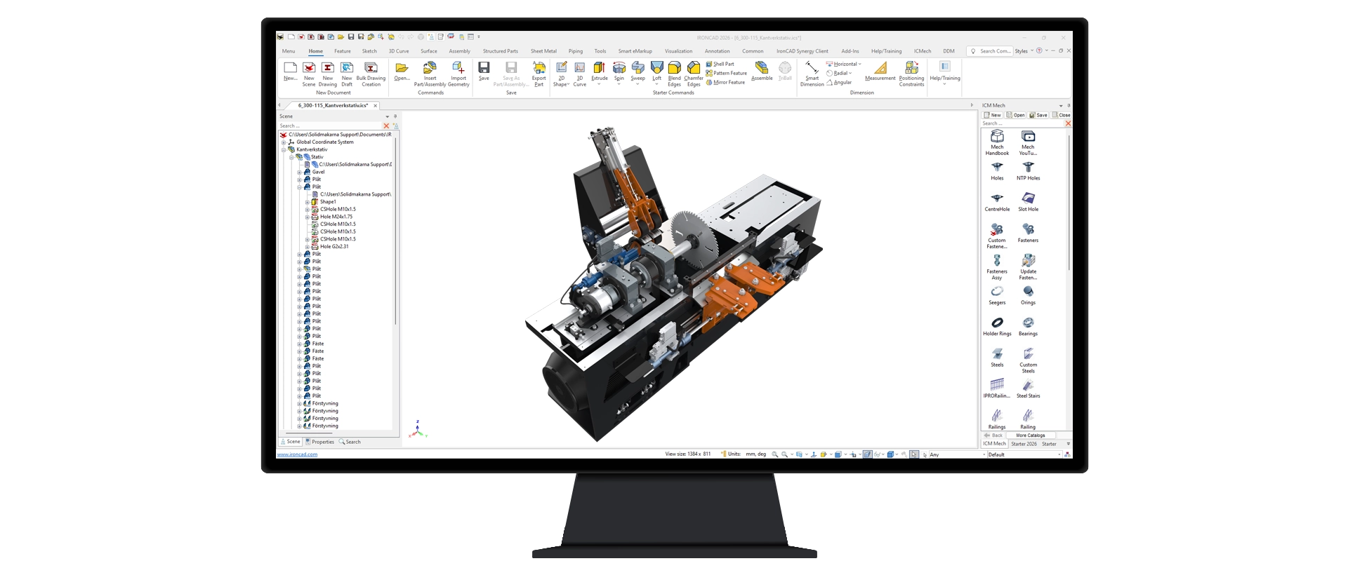 Computer screen displaying IRONCAD with a 3D mechanical assembly featuring gears, motors, and orange and black components.