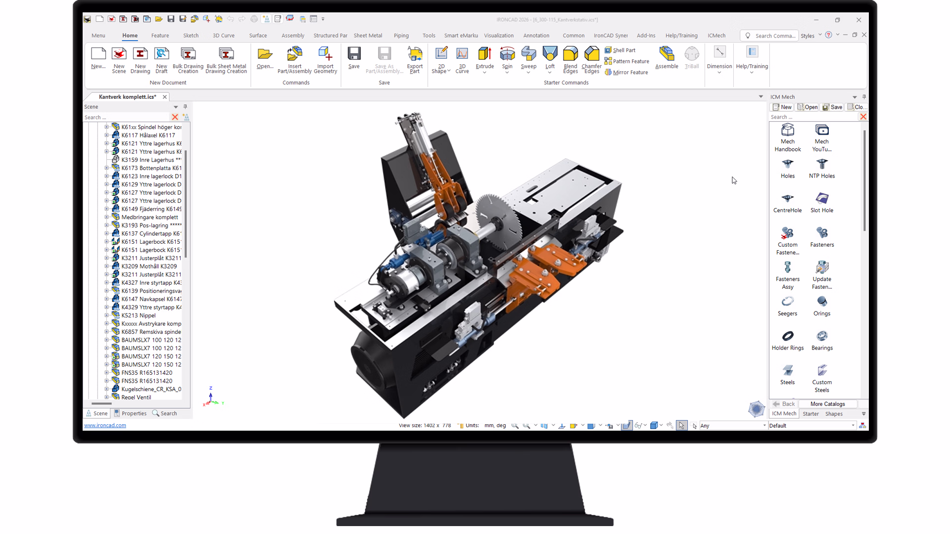 Computer monitor displaying a 3D CAD software interface with a mechanical assembly model featuring gears and orange components.