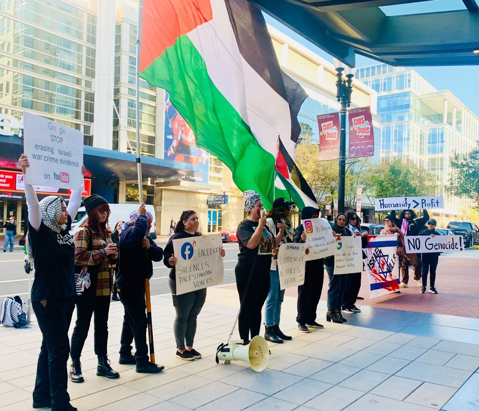 Protesting calling out Meta and Google employees for silencing Palestinian voices in Washington DC.