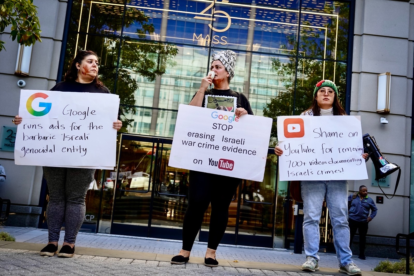 Human rights activists outside Google office in Washington DC calling out their complicity in Israel's genocide.