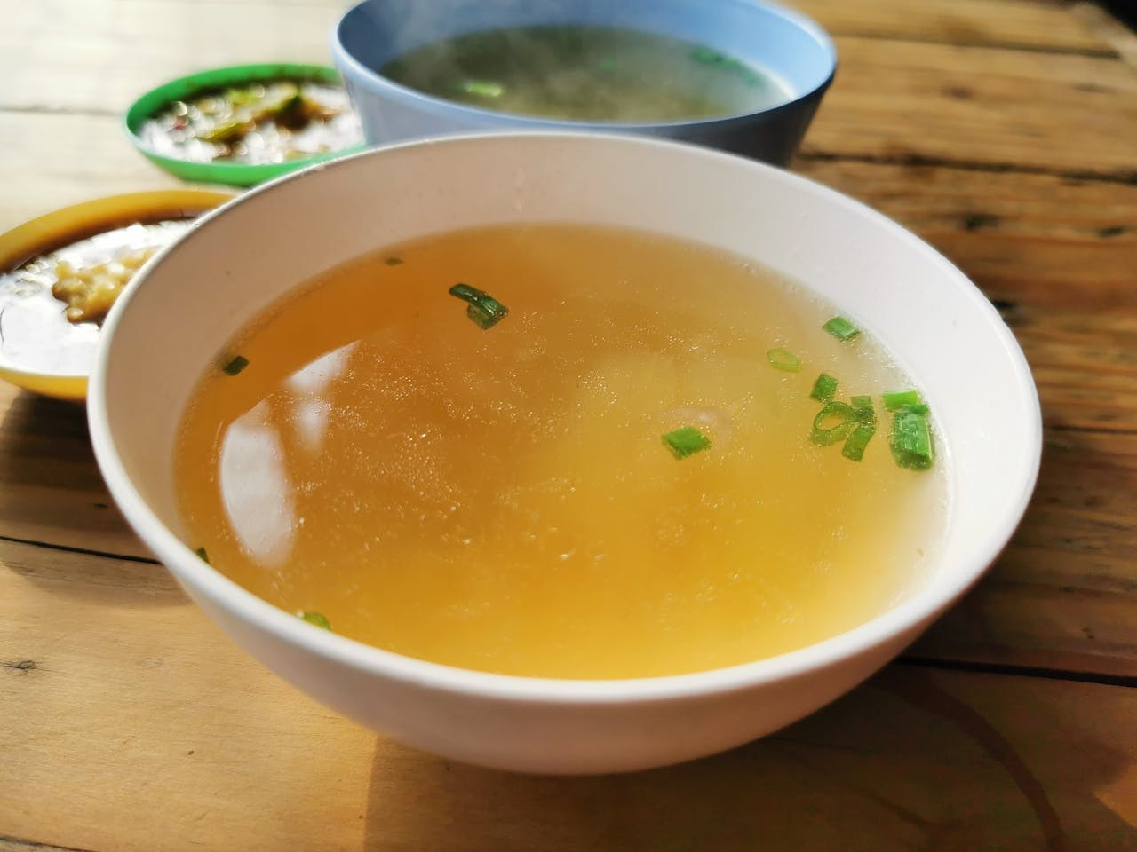 bowl of bone broth packed with liquid collagen