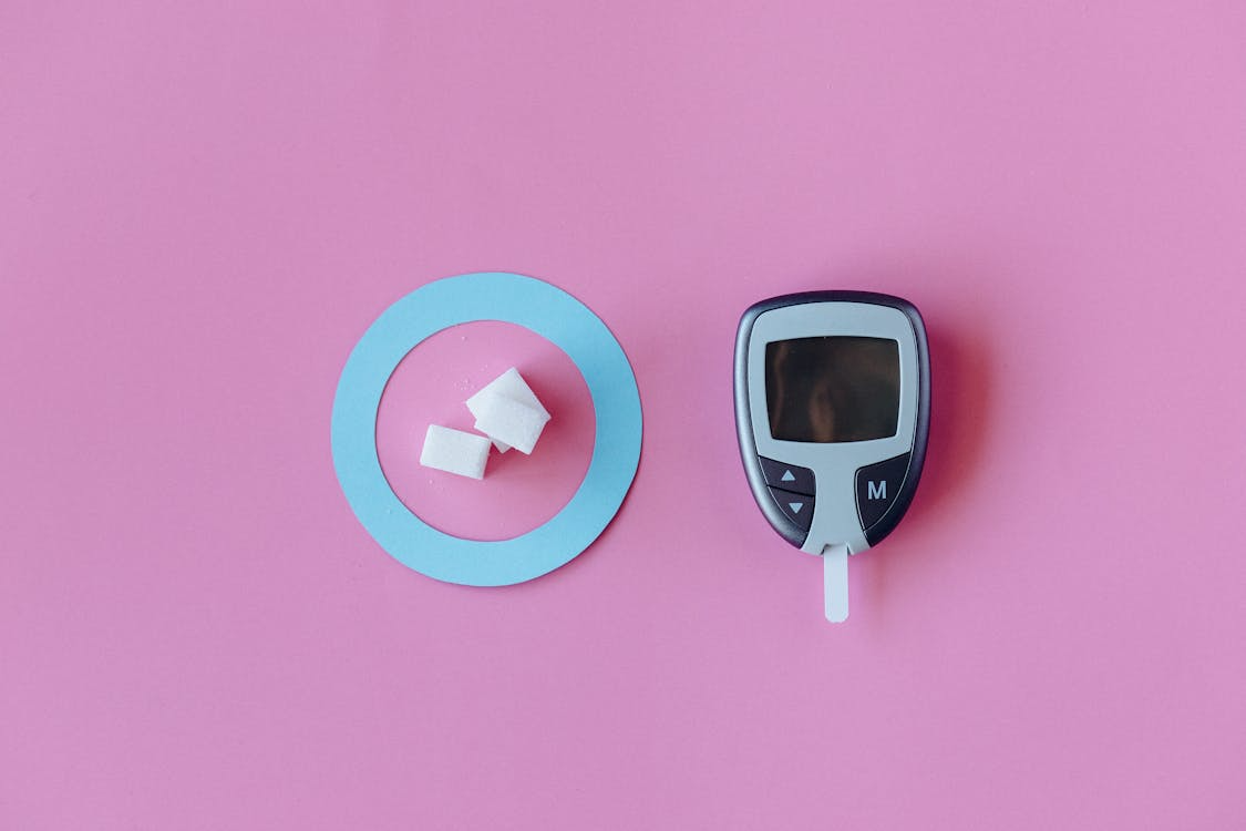 Detailed view of a digital blood glucose meter with a clear screen showing glucose levels.