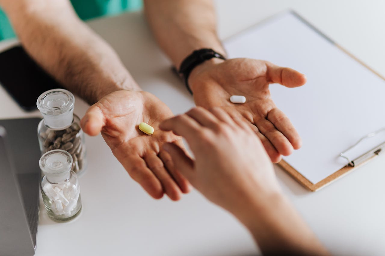 A man and a woman each hold a pill, looking at each other with expressions of curiosity and concern.