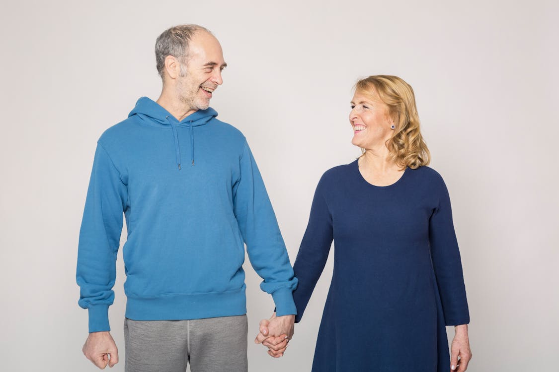 happy middle aged couple holding hands