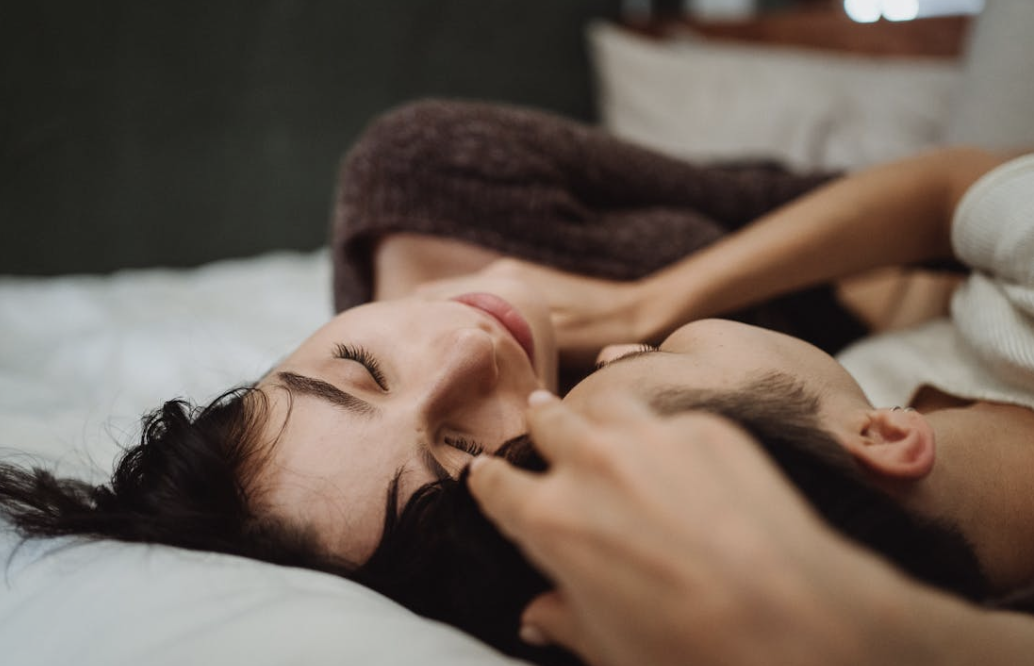 couple lying next to each other having a restful mental health day
