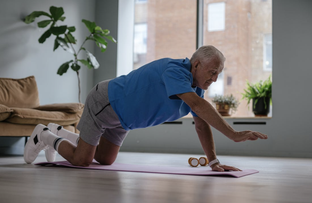 healthy older man doing an at home workout