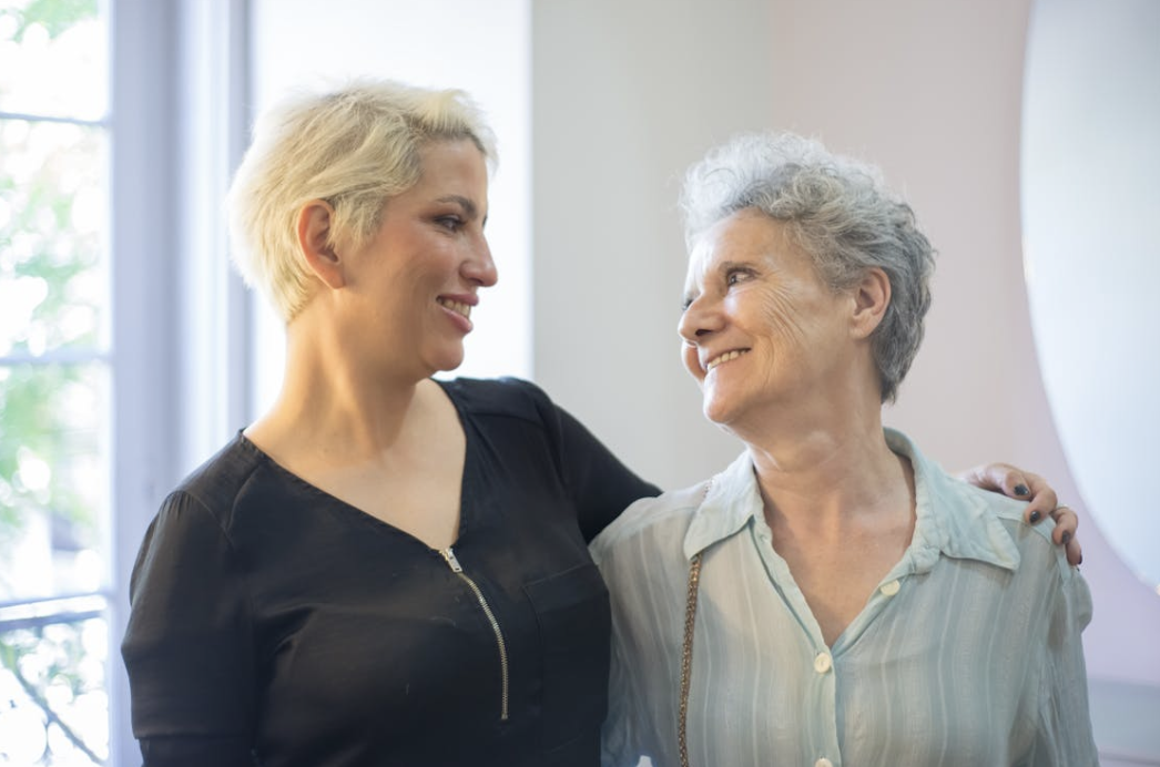 women of different ages embracing as they figure out how to pursue a healthy lifestyle