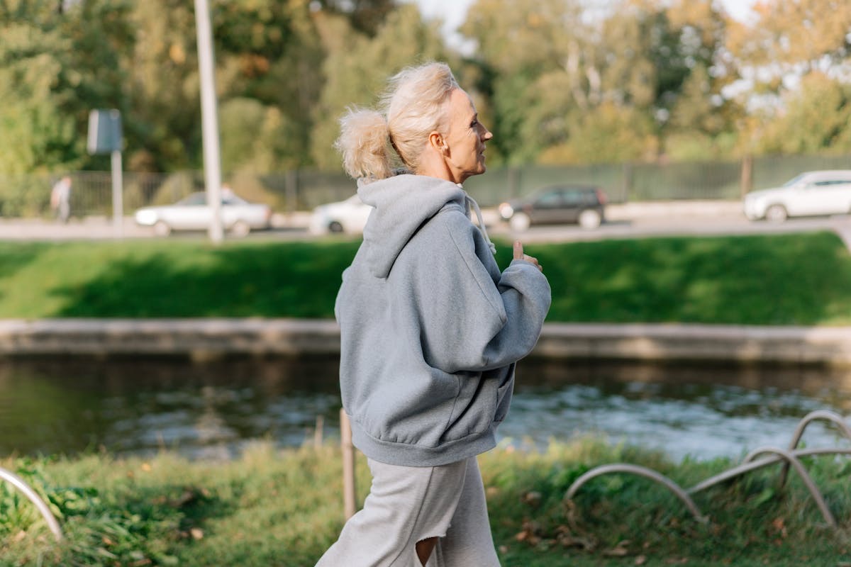 middle aged woman on a run in the park