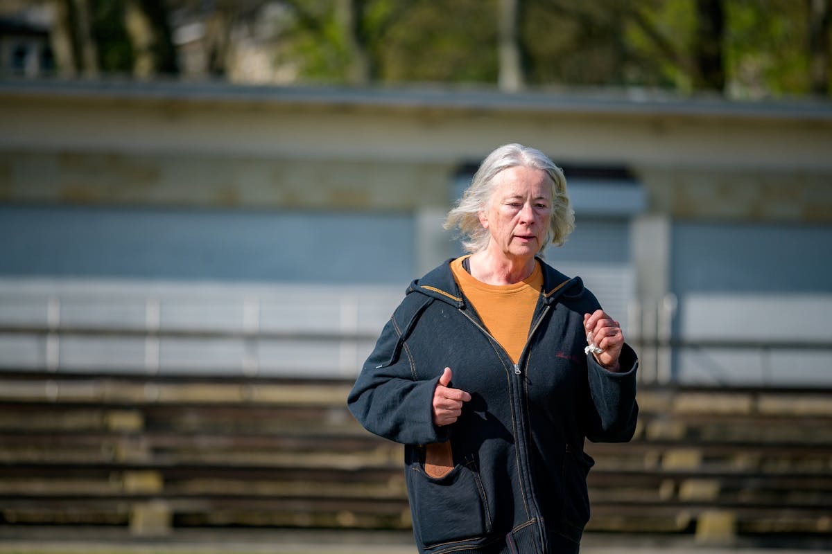 older woman on a brisk walk keeping active and healthy