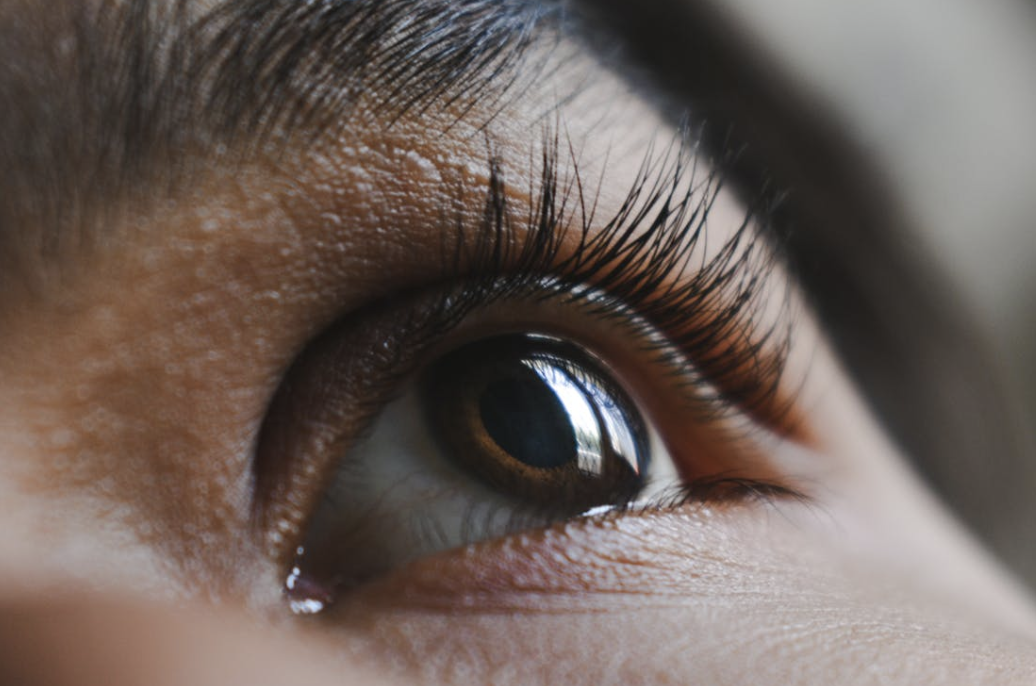 close up of a brown-eyed woman's long, healthy eyelashes