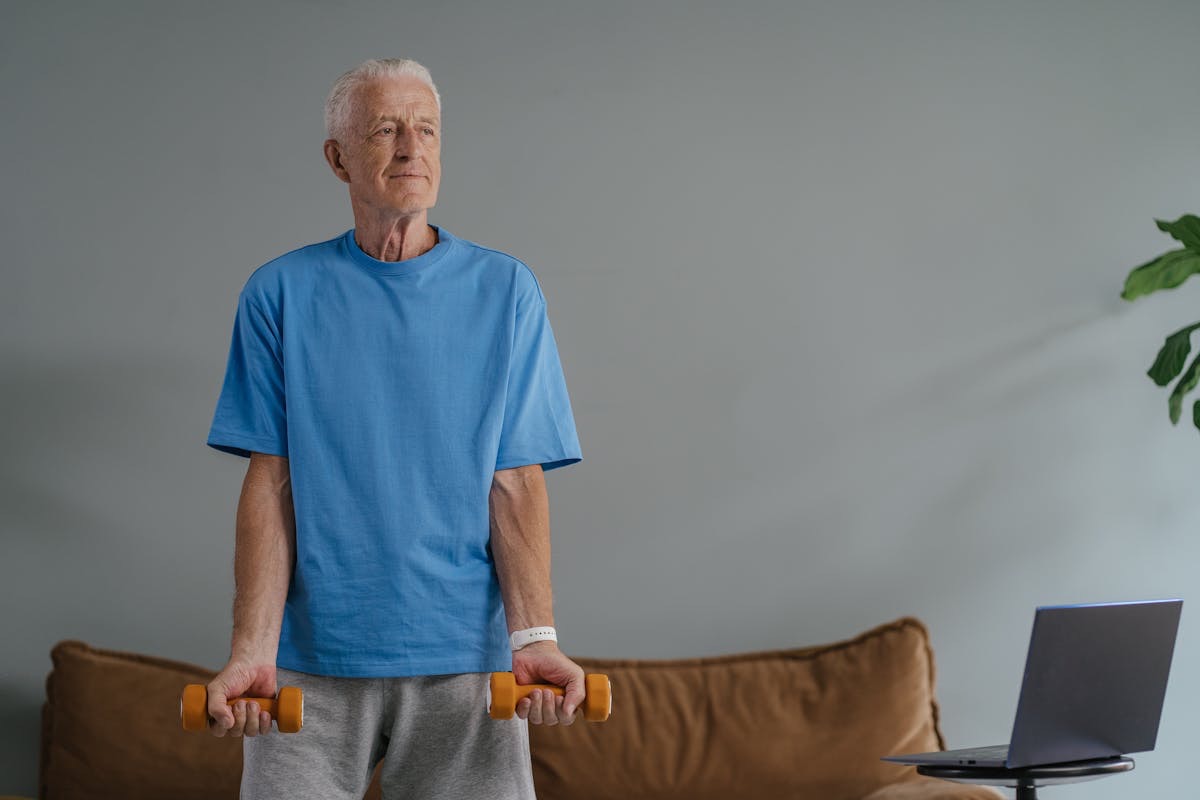man holding light dumbells in his hands as he starts making healthy choices like exercise and taking nmn