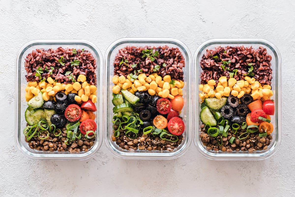 balanced meals prepped in tupperware containers