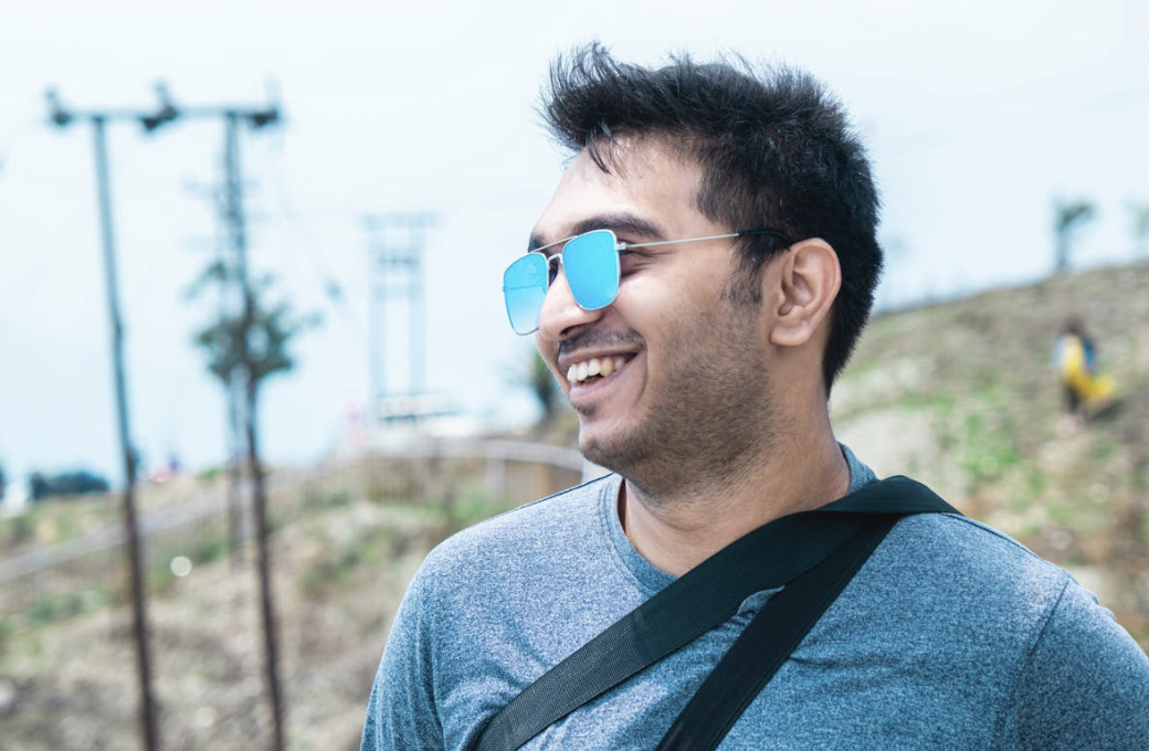 relaxed man who takes nootropics for their cognitive benefits enjoying a pleasant mood outdoors
