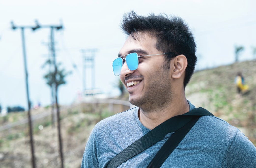 relaxed man who takes nootropics for their cognitive benefits enjoying a pleasant mood outdoors