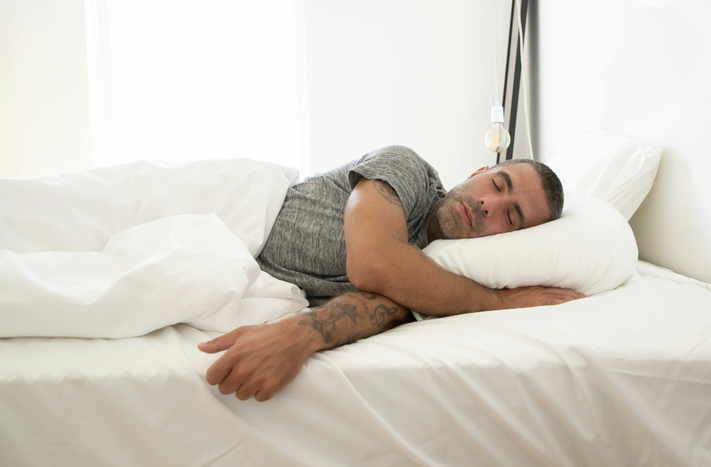 man enjoying a peaceful night of quality sleep after taking a collagen supplement