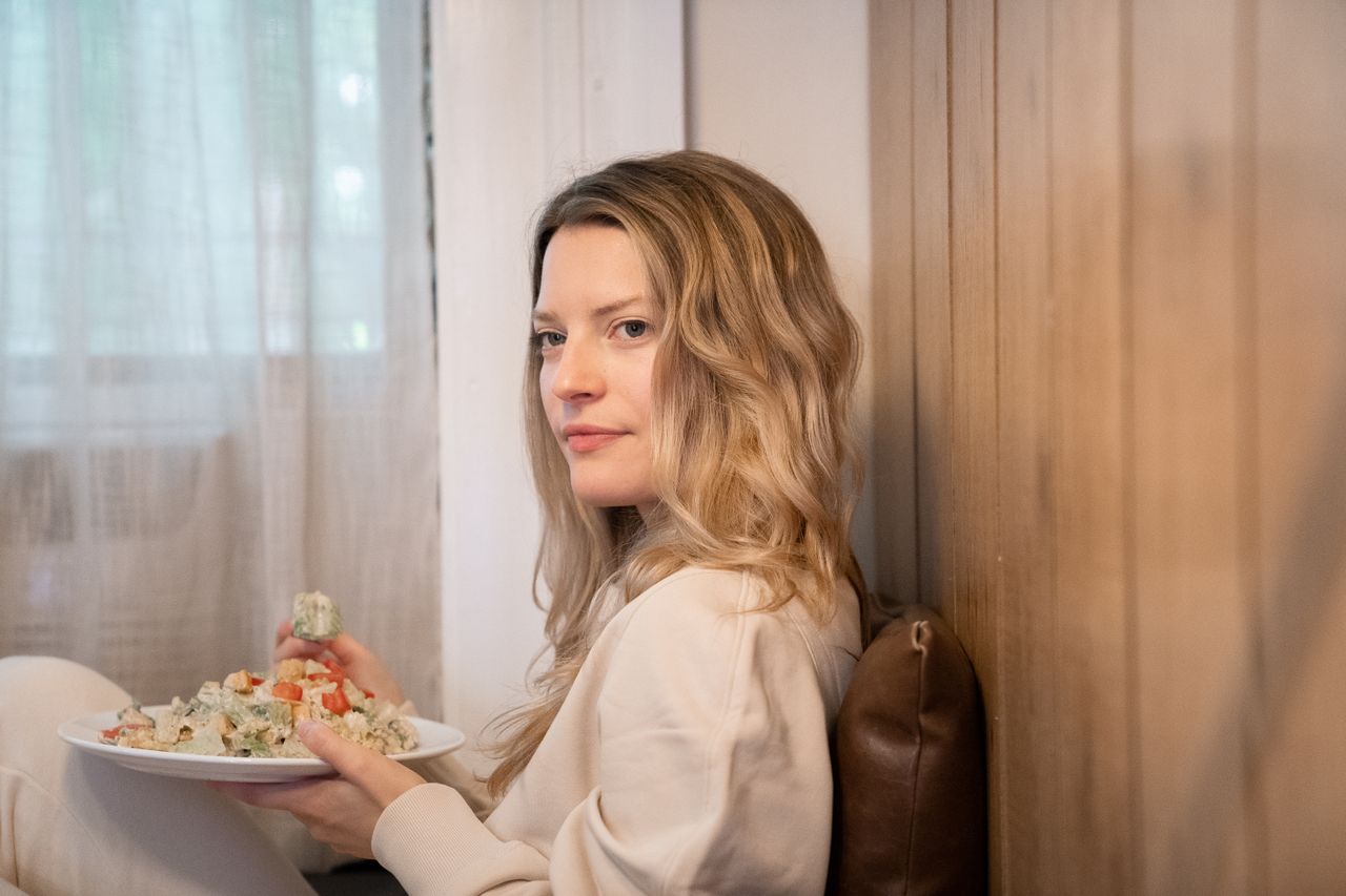 woman mindfully eating a balanced meal