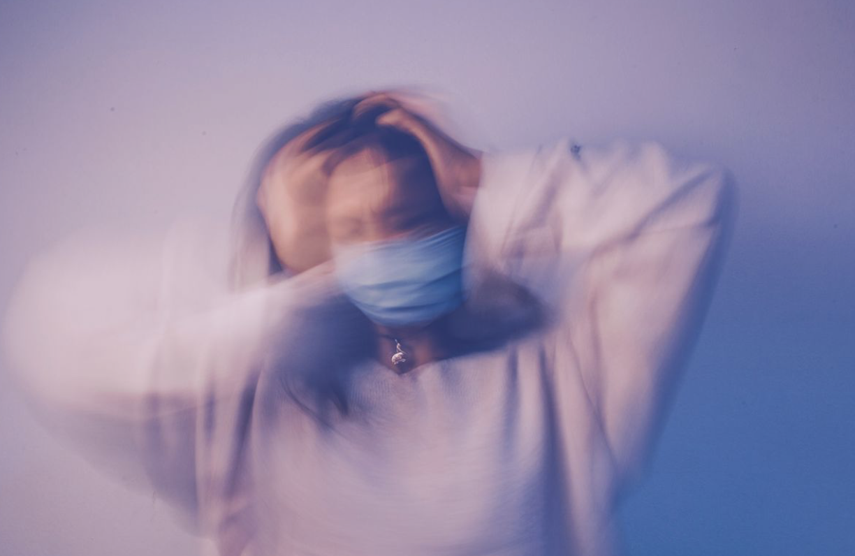 woman with anxiety holding her head because she's trying to figure out a nonmedication remedy