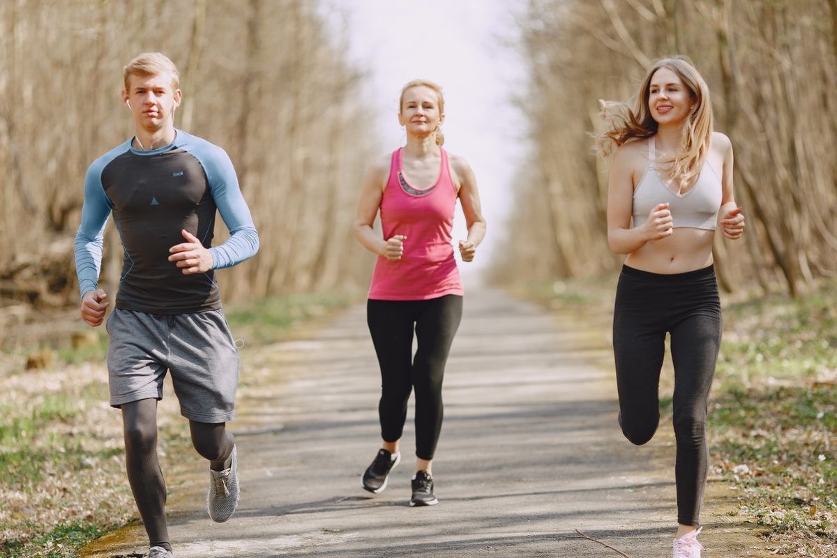 family running together on a trail