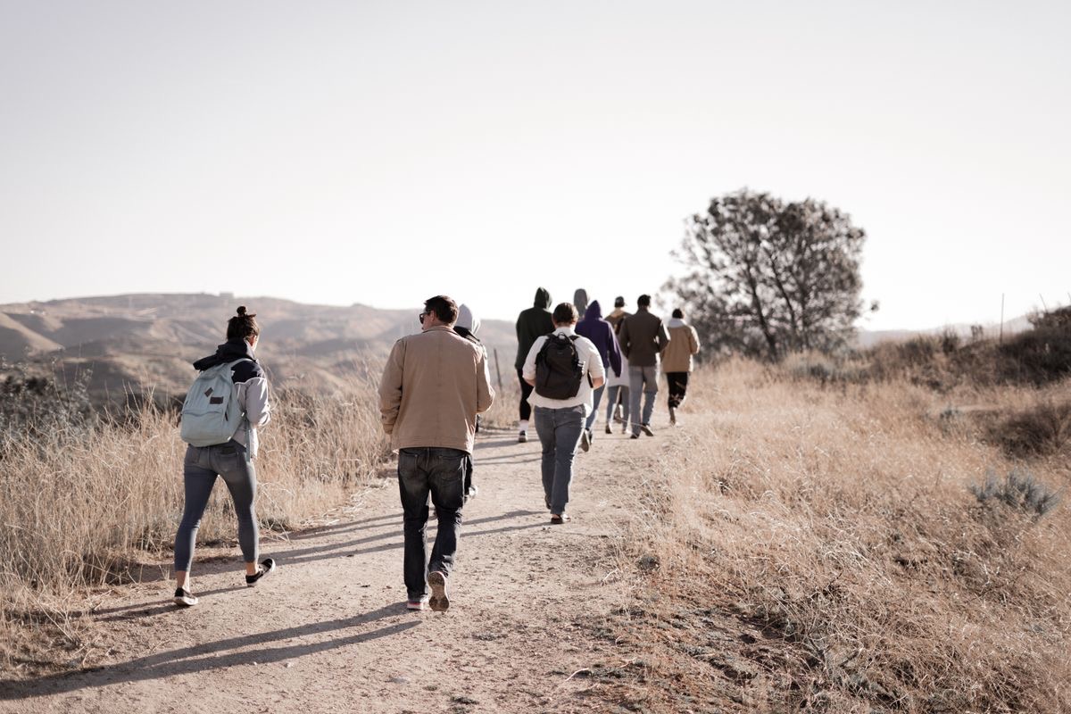 group of hikers backpacking on a trail