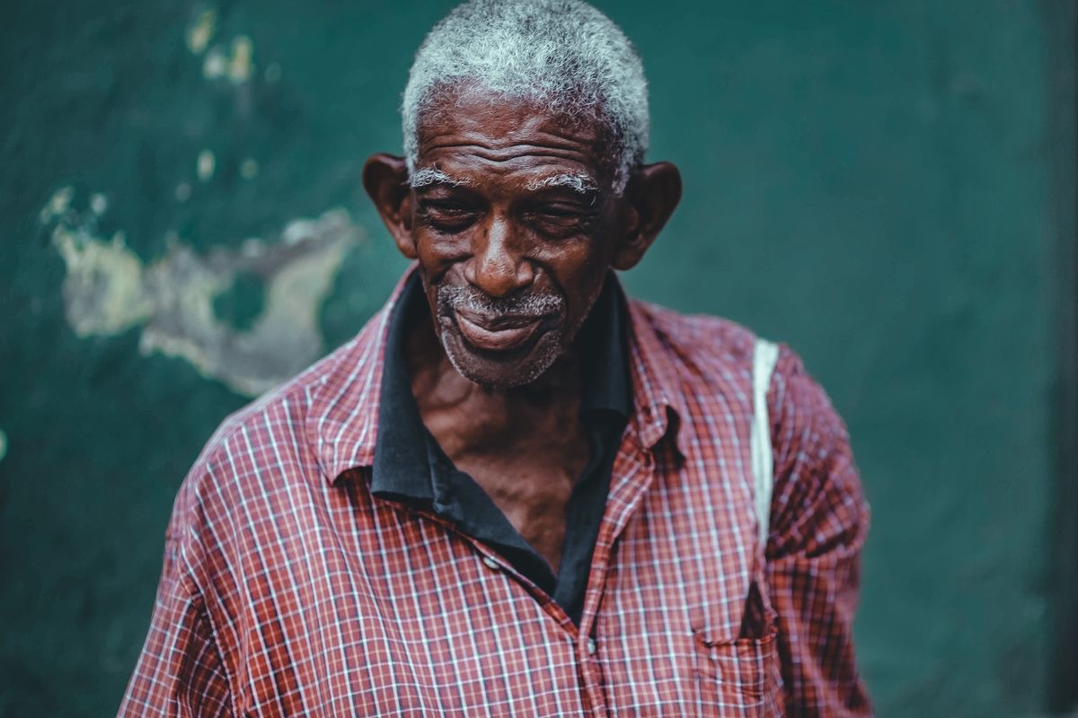 older man smiling, feeling good because he's making small lifestyle choices to contribute to healthy aging