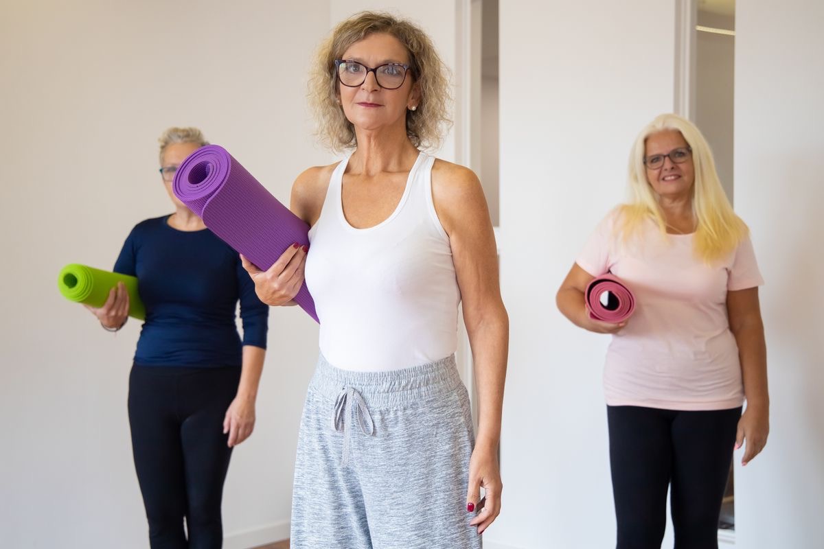 healthy older women getting ready for yoga class