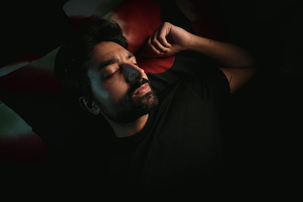 man lying on his back sleeping